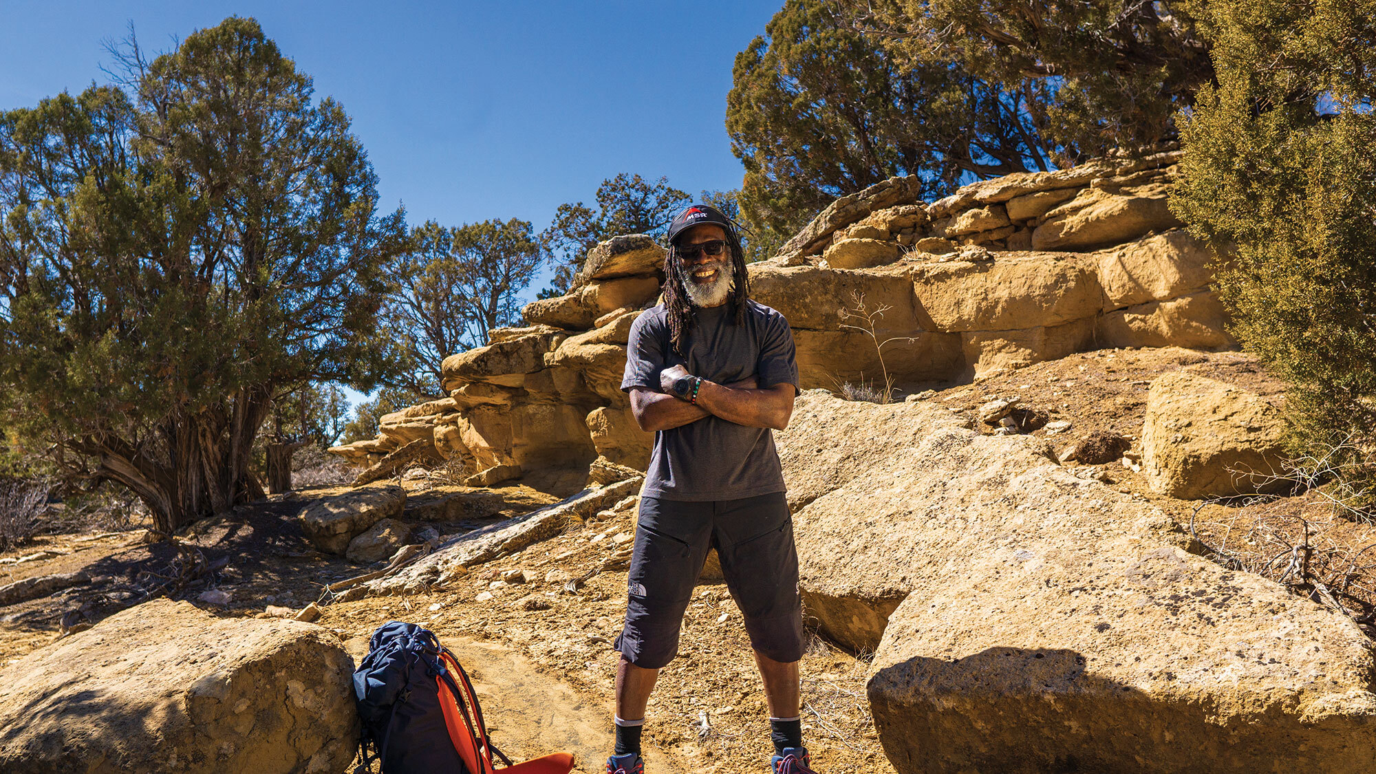 Man hiking desert mountain path